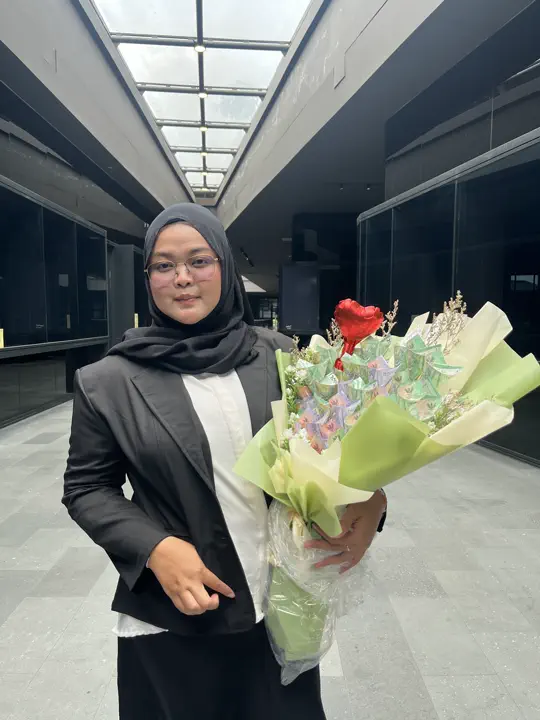 Wahyu Binarti after finishing her master's defense