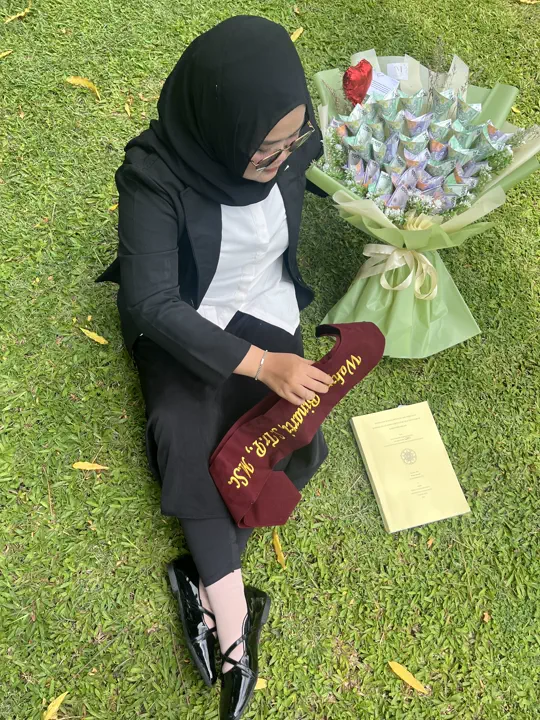 Wahyu Binarti after completing her master's thesis defense at UGM